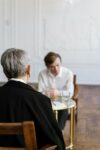 A person meeting with a mediator to find a resolution to a dispute